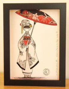 tableau encre et papier dans un cadre vitrine petit format représentant un personnage appelé Poupir Kokeshi dans sa tenue traditionnelle japonaise.